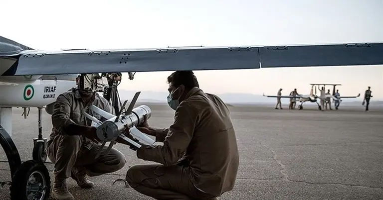 ড্রোনে অস্ত্র সংযোজনের প্রস্তুতিতে কর্মীরা